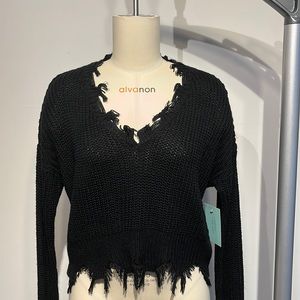 BRAND NEW black knit V-neck sweater with fringes. Very soft.